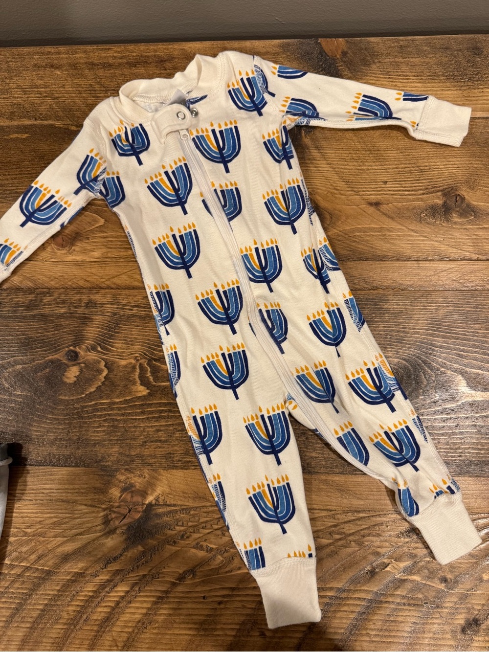 Hanna Andersson Cream Footie Pajamas with Blue & Yellow Menorah Print